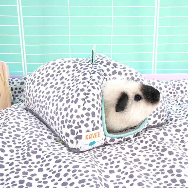 white and black guinea pig inside Kavee Dreamy Dalmatian print fleece hidey house, on dalmatian print fleece liner in white c&c cage with lilac coroplast