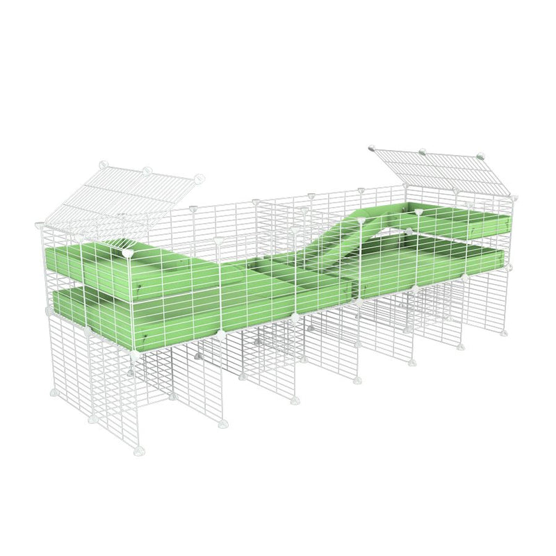 A 6x2 white C&C cage with divider and stand loft ramp for guinea pig fighting or quarantine with green coroplast from brand kavee