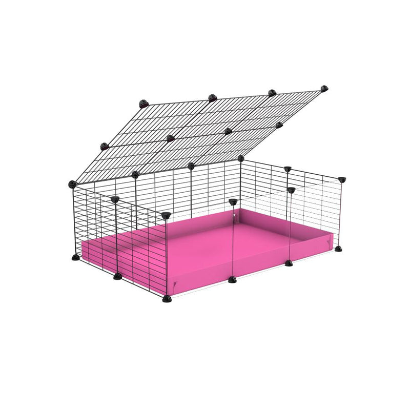 A 2x3 C and C cage with clear transparent plexiglass acrylic grids  for guinea pigs with pink coroplast a lid and small hole grids from brand kavee