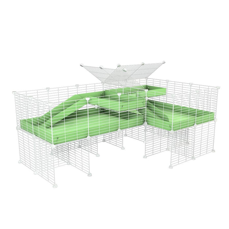 A 6x2 L-shape white C&C cage with divider and stand loft ramp for guinea pig fighting or quarantine with green coroplast from brand kavee