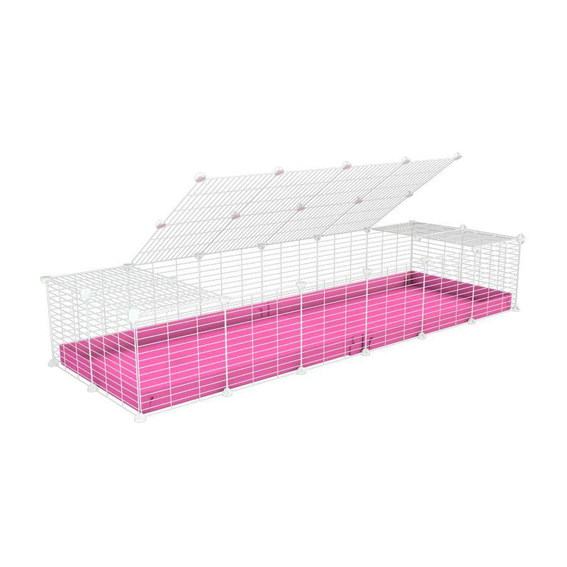 A 2x6 C and C cage for guinea pigs with pink coroplast a lid and small hole white C&C grids from brand kavee