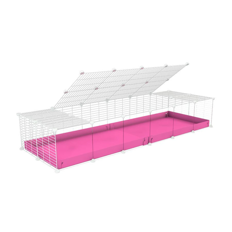 A 2x6 C and C cage with clear transparent plexiglass acrylic grids  for guinea pigs with pink coroplast a lid and small hole white C&C grids from brand kavee