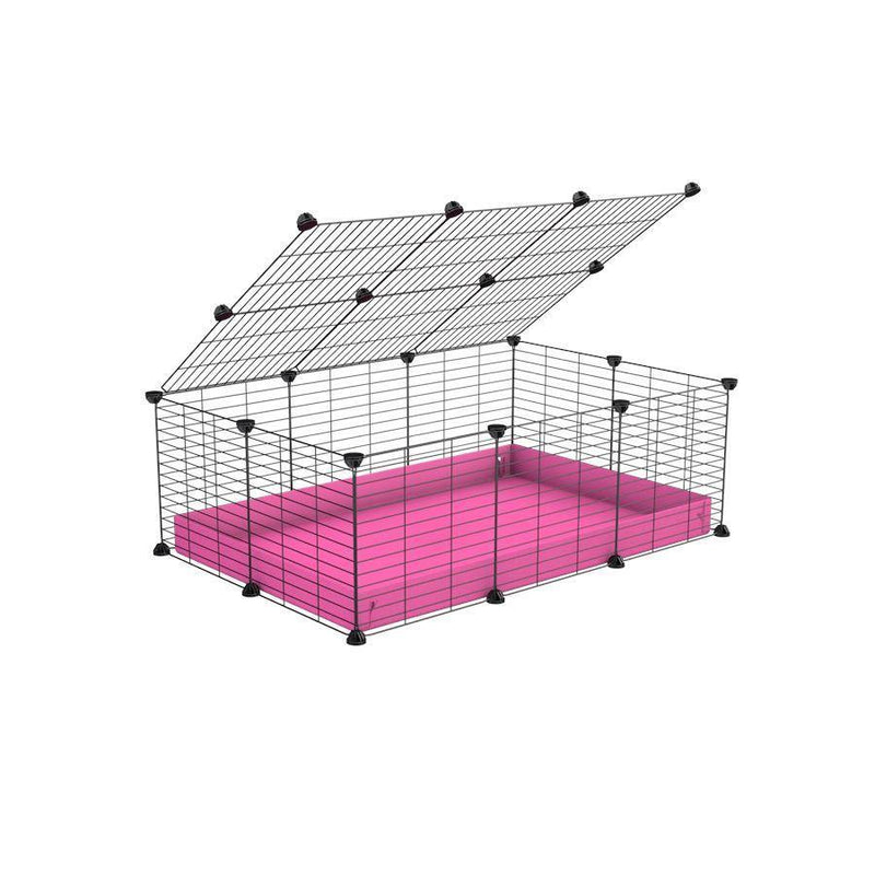 A 2x3 C and C cage for guinea pigs with pink coroplast a lid and small hole grids from brand kavee