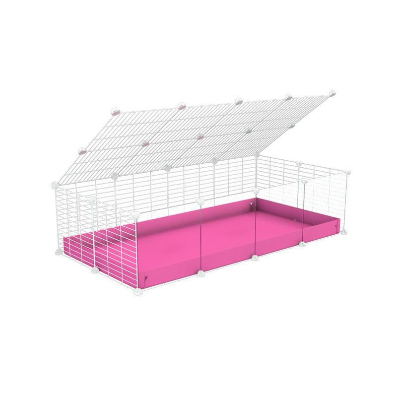 A 2x4 C and C cage with clear transparent plexiglass acrylic grids  for guinea pigs with pink coroplast a lid and small hole white CC grids from brand kavee