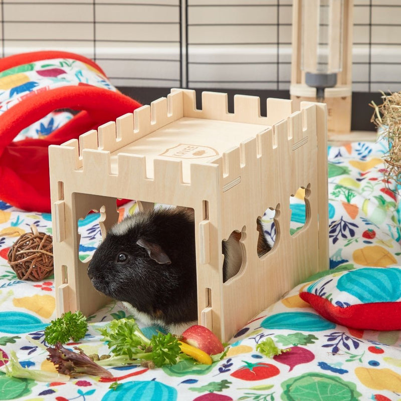 guinea pig inside of kavee wooden tunnel with guinea pig cut out window cut outs on top of kavee red veggie fleece liner