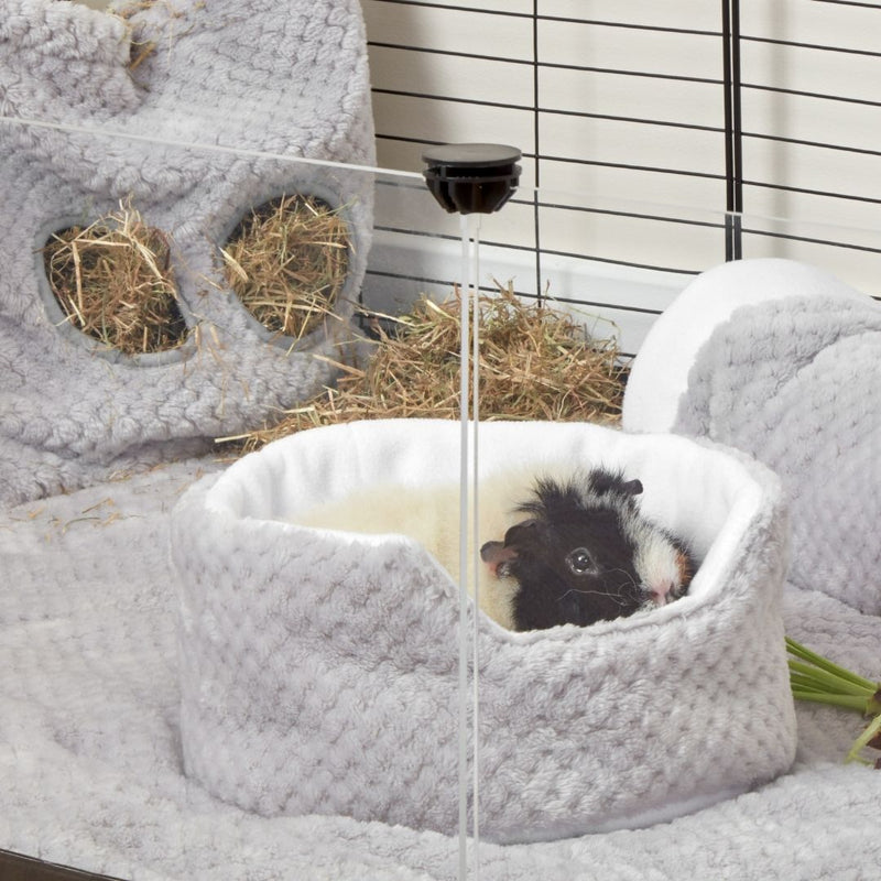 guinea pig lay inside of a kavee gray cuddle cup on top of a kavee fleece liner