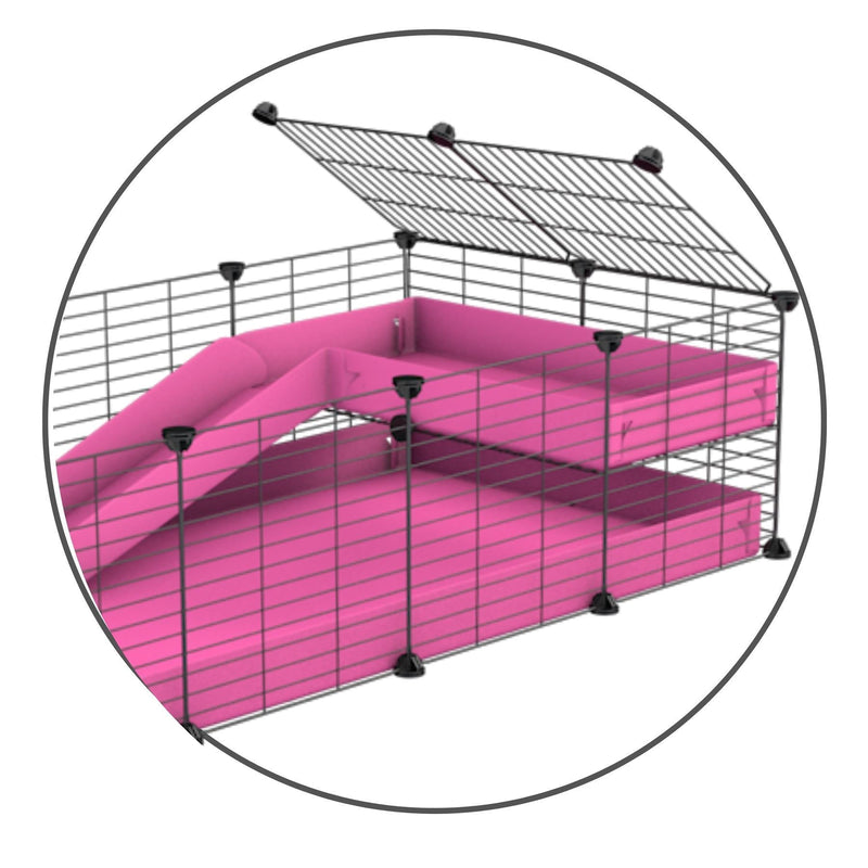 A kit to add a ramp to a C&C cage with a pink coroplast ramp and 2x1 loft and small hole size safe CC grids