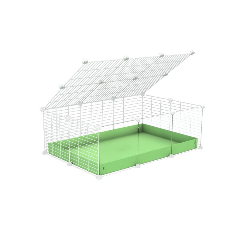 A 2x3 C and C cage with clear transparent plexiglass acrylic grids  for guinea pigs with green pastel pistachio coroplast a lid and small hole white grids from brand kavee
