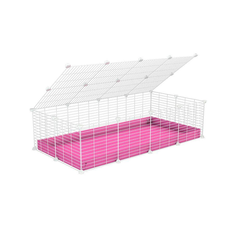 A 2x4 C and C cage for guinea pigs with pink coroplast a lid and small hole white CC grids from brand kavee