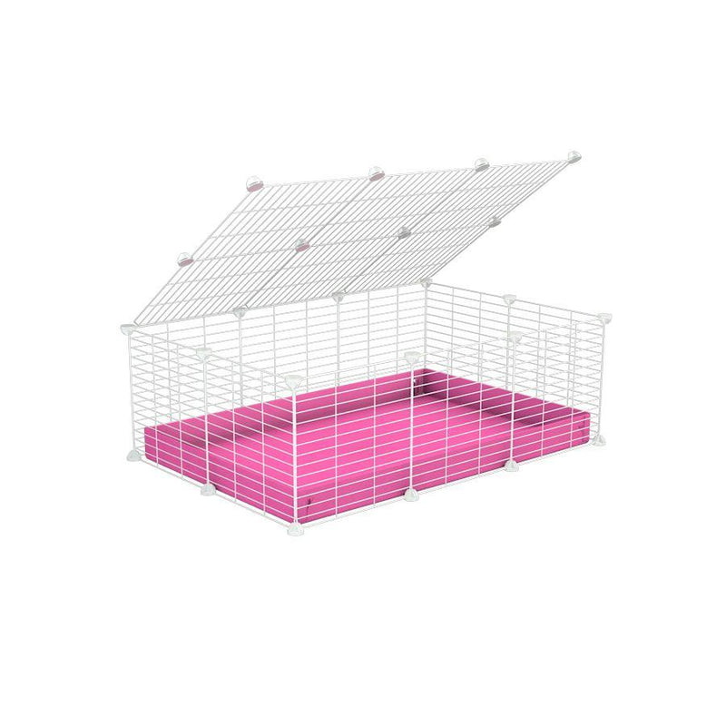 A 2x3 C and C cage for guinea pigs with pink coroplast a lid and small hole white grids from brand kavee